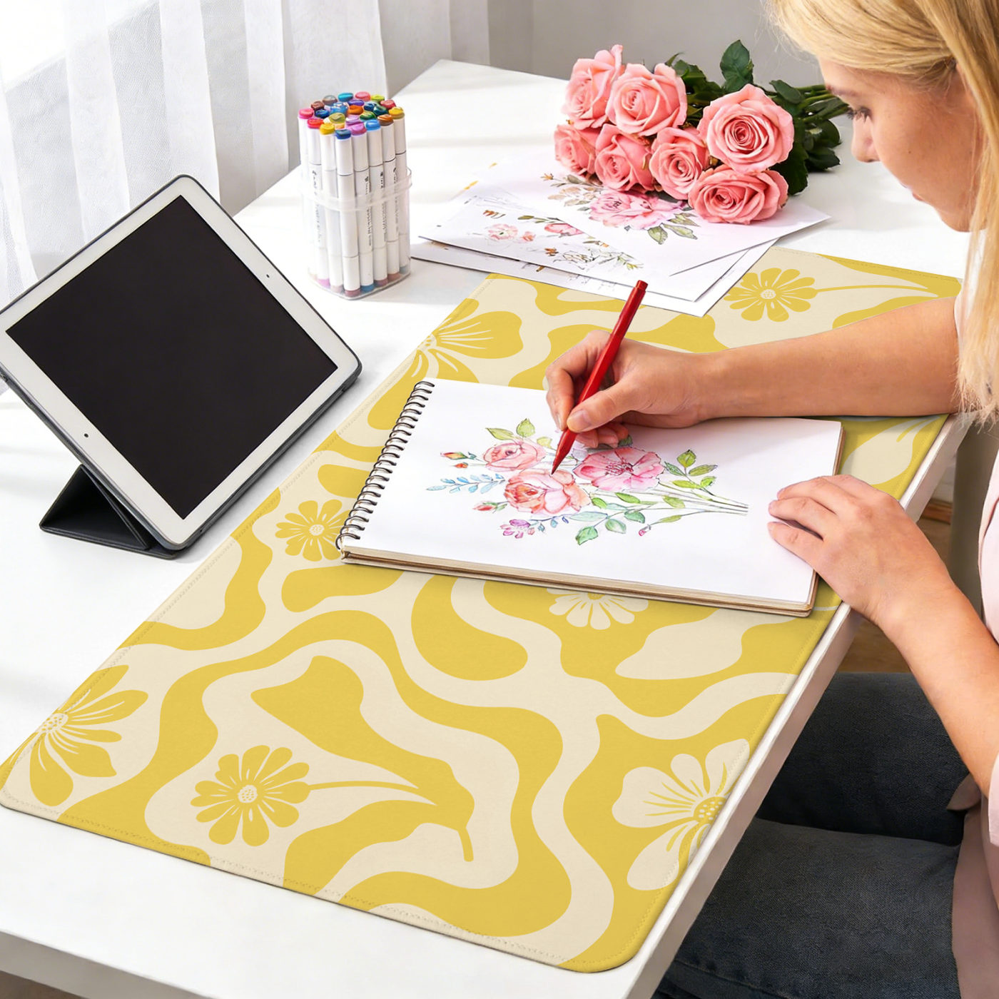 Yellow abstract daisy writing pad on a desk